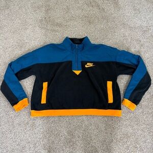 Nike women’s teal, black, and gold cropped quarter zip size M
